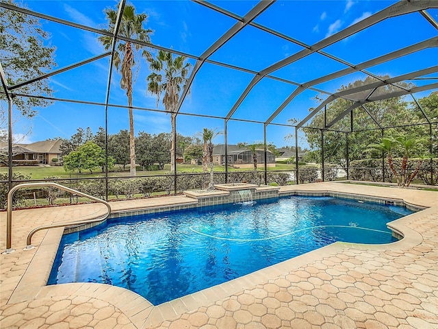 view of pool with an in ground hot tub, a lanai, and a patio