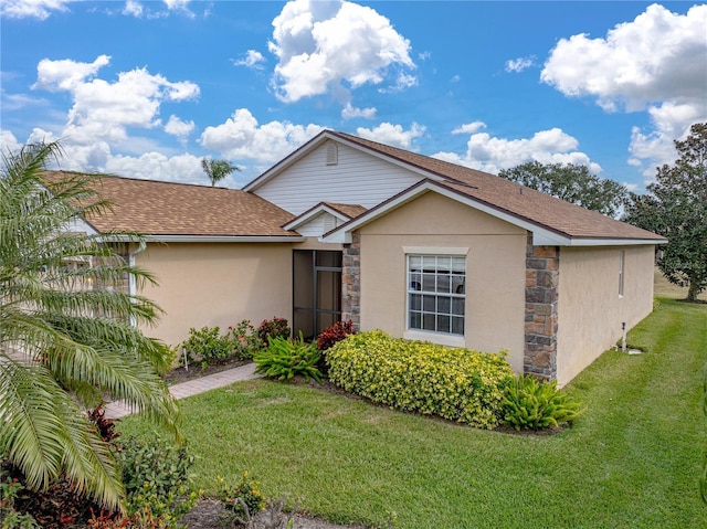 ranch-style house with a front lawn