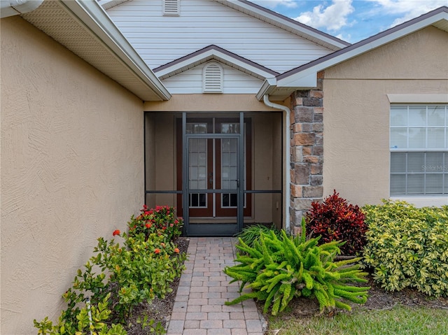 property entrance featuring french doors