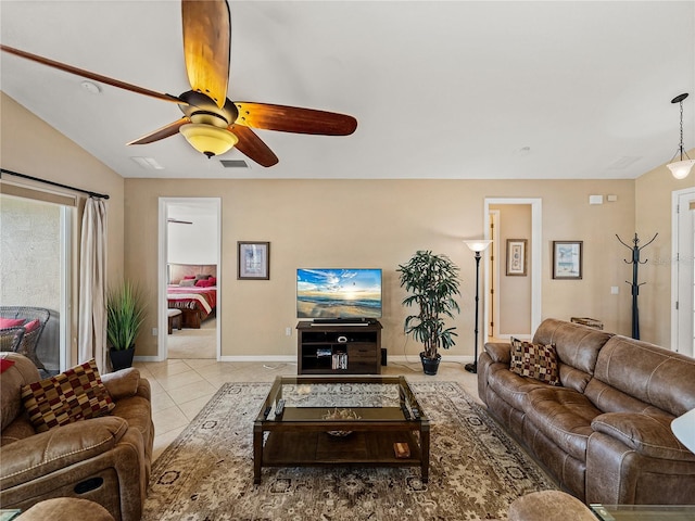 living room featuring ceiling fan and light tile patterned floors