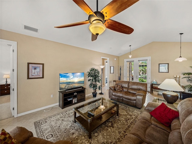 living room with ceiling fan, french doors, vaulted ceiling, and light tile patterned flooring