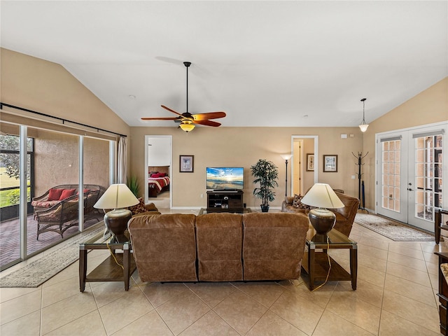 living room with ceiling fan, light tile patterned floors, lofted ceiling, and french doors