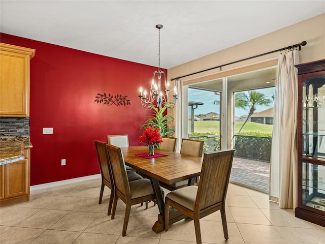 dining room featuring light tile patterned floors and a notable chandelier