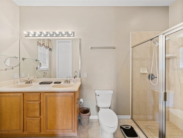 bathroom featuring toilet, walk in shower, vanity, and tile patterned flooring