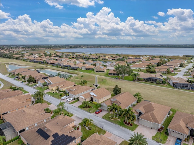 drone / aerial view with a water view