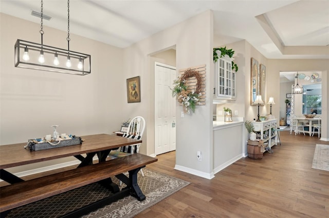 dining space featuring hardwood / wood-style floors