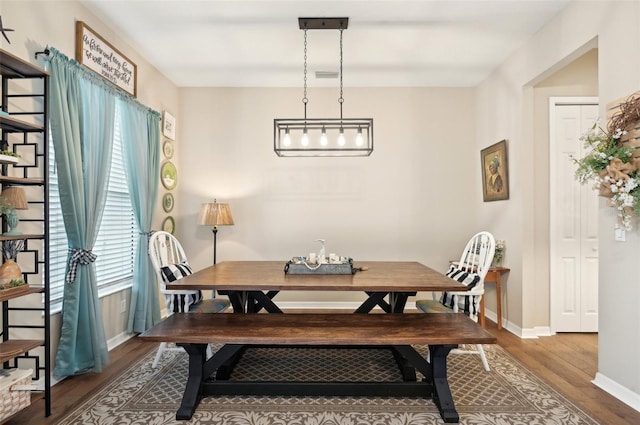 dining room with hardwood / wood-style flooring