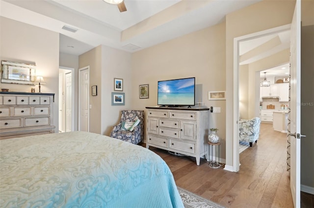 bedroom with ceiling fan and wood-type flooring