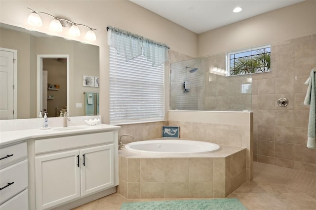 bathroom with tile patterned floors, vanity, and plus walk in shower