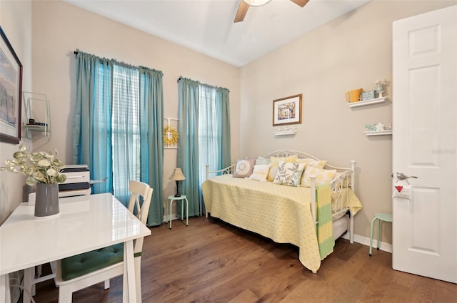 bedroom featuring ceiling fan and hardwood / wood-style flooring