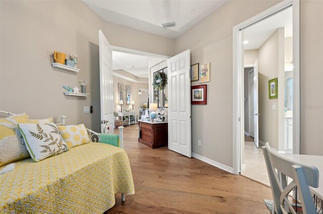 bedroom with light hardwood / wood-style floors