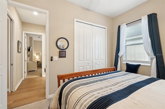 carpeted bedroom with a closet