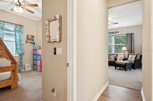 hallway with light carpet