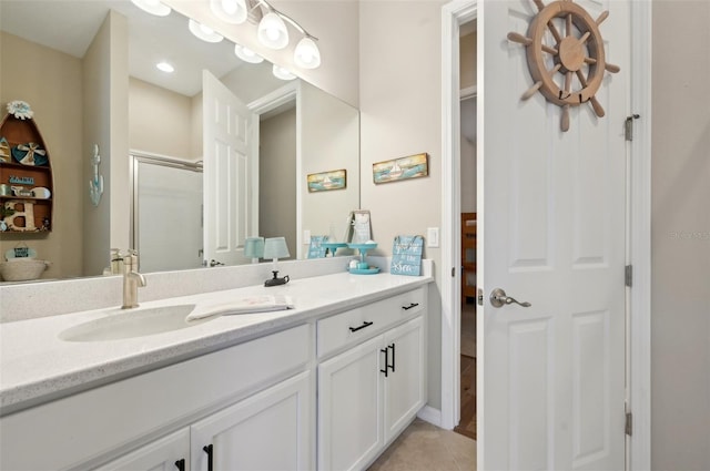 bathroom featuring vanity, tile patterned flooring, and an enclosed shower