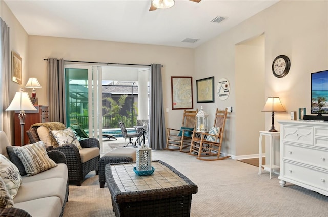 living room with ceiling fan and light carpet