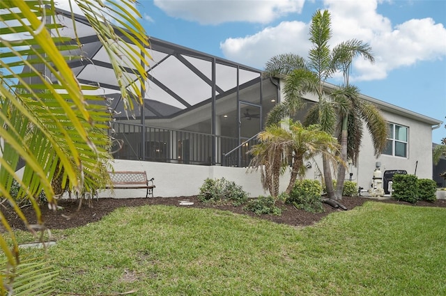 view of yard with a lanai and central air condition unit