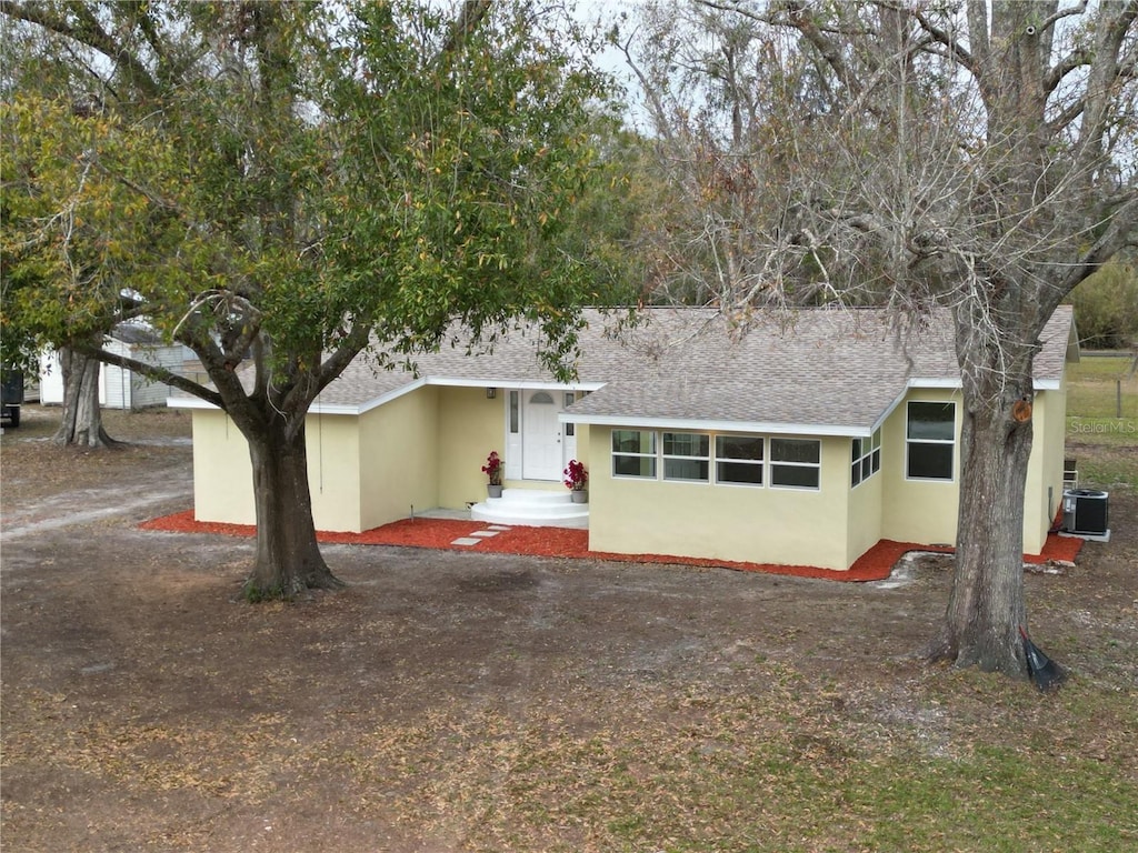 view of front of house with central AC unit