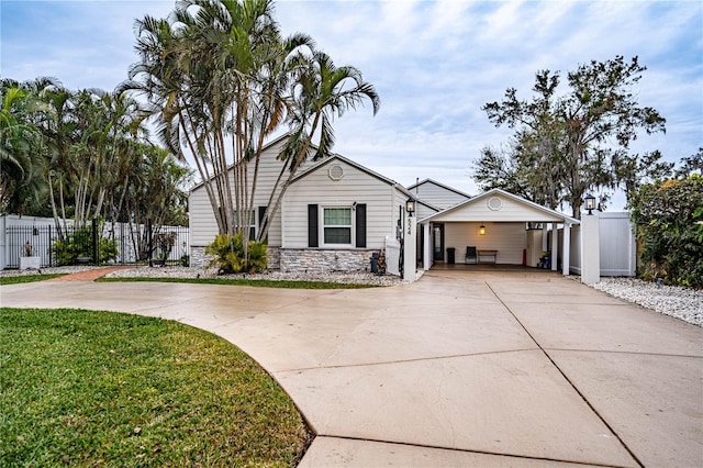 single story home featuring a carport