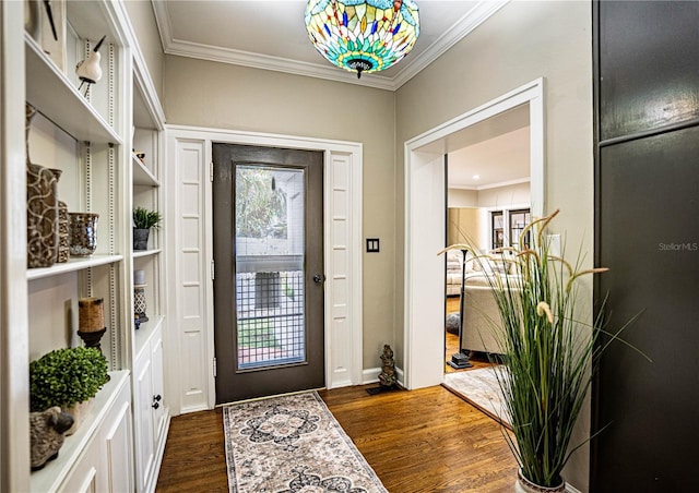 entryway with dark hardwood / wood-style flooring and crown molding