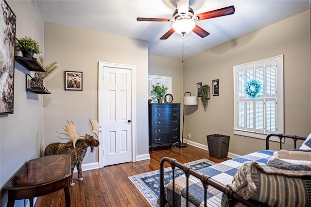 bedroom featuring ceiling fan and dark hardwood / wood-style floors