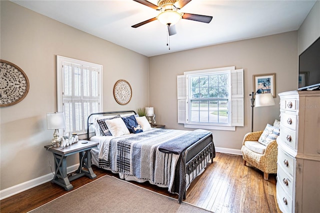 bedroom with ceiling fan and hardwood / wood-style floors