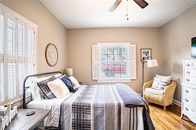 bedroom featuring ceiling fan and light hardwood / wood-style flooring