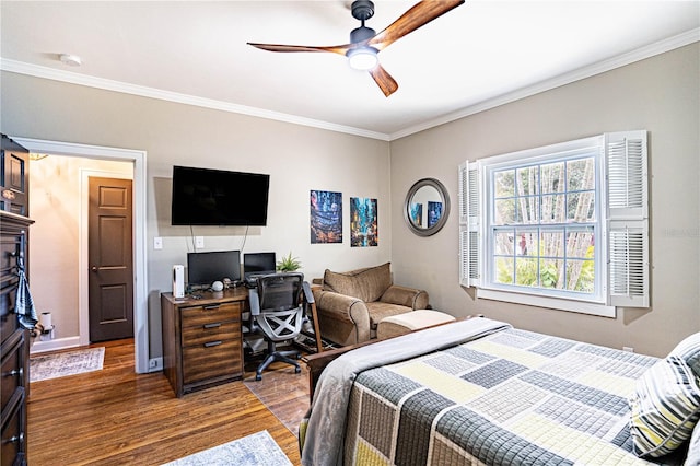 bedroom with ceiling fan, dark hardwood / wood-style flooring, and ornamental molding