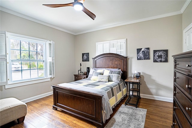 bedroom with ceiling fan, hardwood / wood-style floors, and crown molding