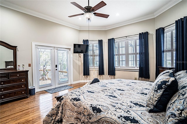 bedroom with ceiling fan, multiple windows, access to outside, and french doors