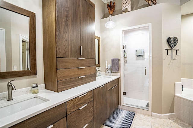 bathroom featuring tile patterned floors, vanity, and plus walk in shower