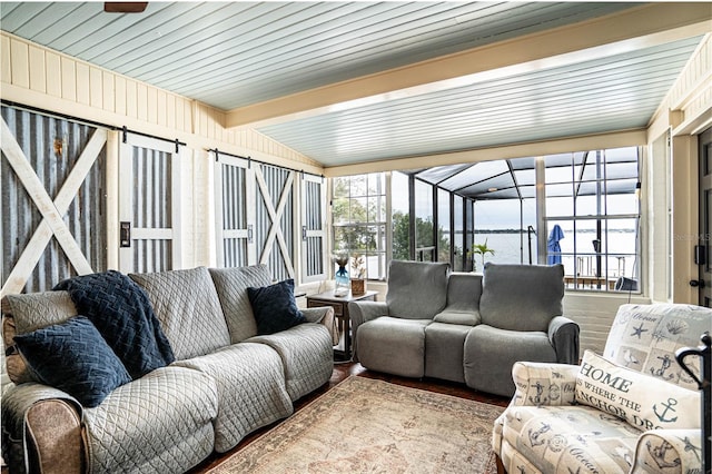 sunroom / solarium featuring lofted ceiling with beams