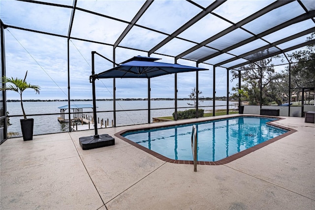 view of swimming pool with a water view, a patio area, and glass enclosure