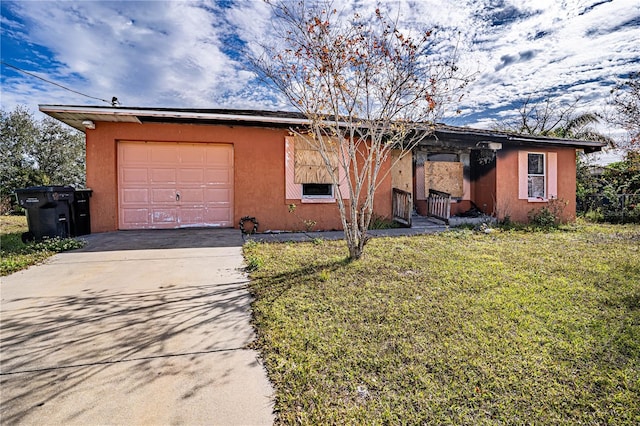 view of front of home with a front lawn and a garage