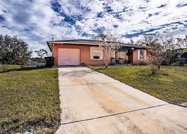 ranch-style house with a front yard and a garage