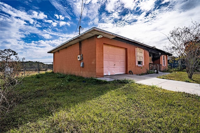 garage featuring a yard