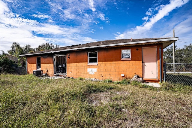 back of property featuring central AC unit