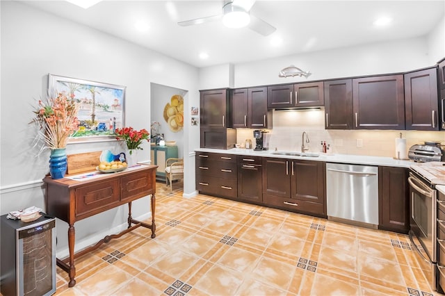 kitchen featuring light tile patterned floors, stainless steel appliances, tasteful backsplash, dark brown cabinetry, and sink