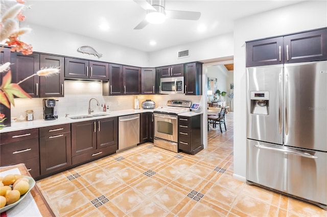 kitchen with sink, backsplash, dark brown cabinetry, and stainless steel appliances