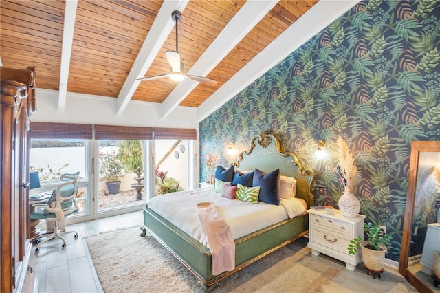 bedroom with ceiling fan, access to exterior, lofted ceiling with beams, hardwood / wood-style flooring, and wooden ceiling