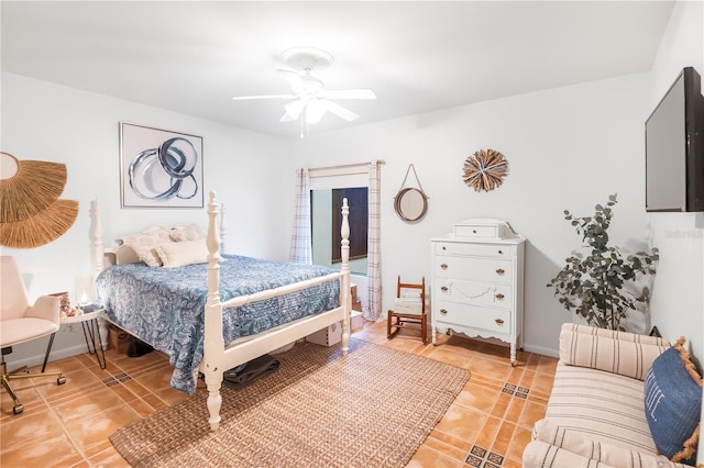 tiled bedroom featuring ceiling fan