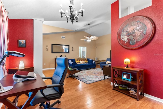 office with ceiling fan with notable chandelier, light hardwood / wood-style flooring, and vaulted ceiling