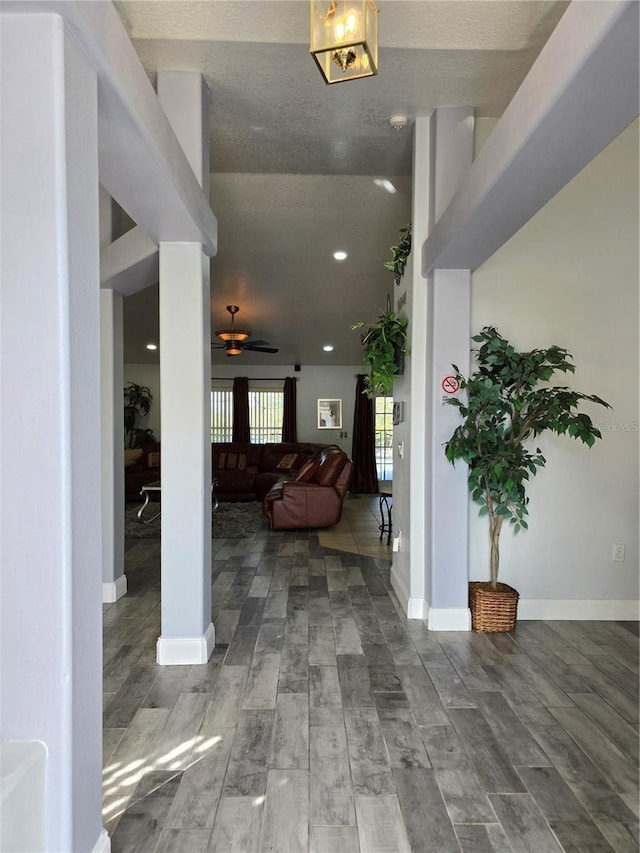 foyer entrance with ceiling fan