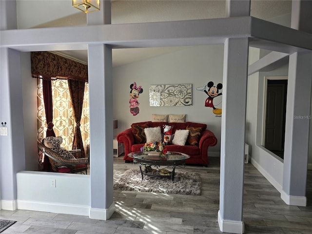 living room featuring wood-type flooring and lofted ceiling