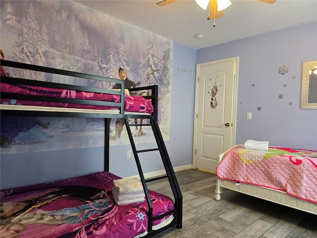 bedroom with ceiling fan and hardwood / wood-style flooring