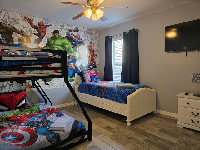 bedroom featuring ceiling fan and hardwood / wood-style floors