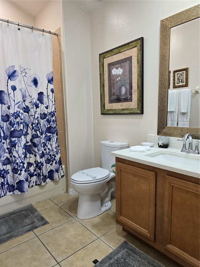 full bathroom featuring toilet, shower / tub combo, tile patterned floors, and vanity