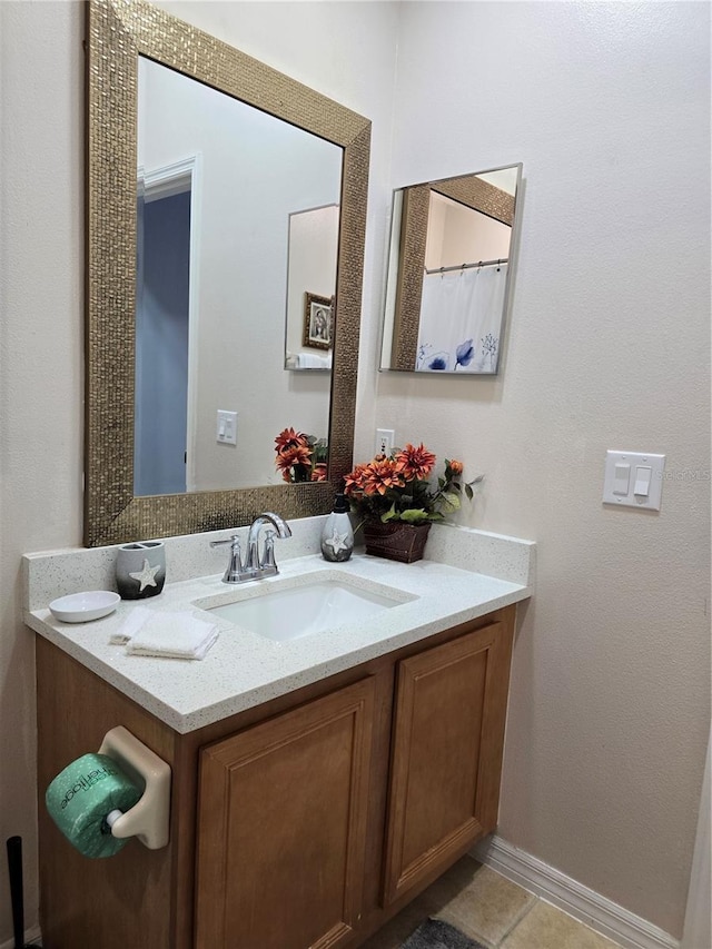 bathroom featuring vanity and tile patterned flooring