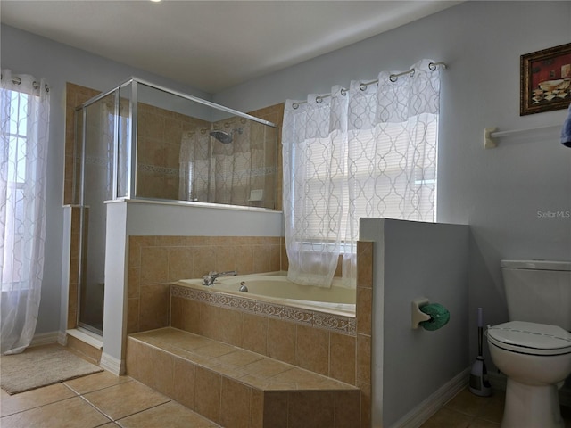 bathroom with toilet, tile patterned flooring, and walk in shower