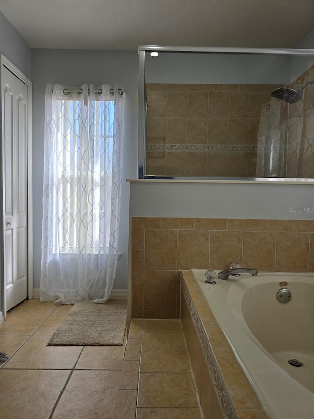 bathroom featuring separate shower and tub and tile patterned floors