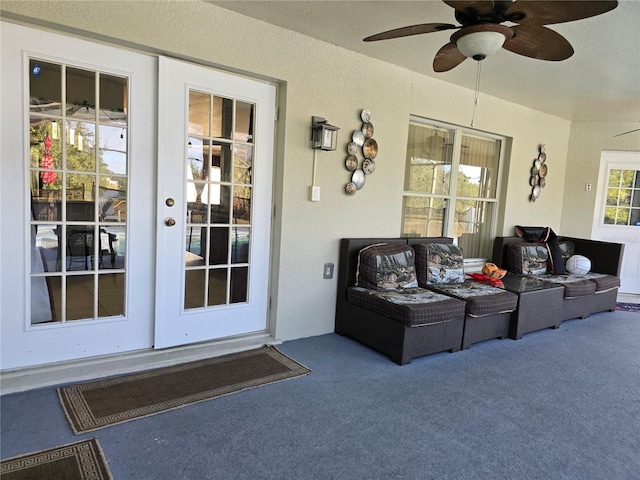 exterior space with ceiling fan and an outdoor living space